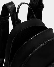 Close-up of the Rudsak GRACE - L325013 Black women’s mini backpack in lightweight technical fabric, showing two zippered compartments (one open to reveal the interior), leather combo details, a carrying handle, and padded shoulder straps.