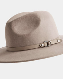 The ZELDA - 8425536 Almond by Rudsak is a light beige women’s wool fedora, crafted from premium felted wool with a wide brim, matching beige band, and a small metal buckle detail around the crown.