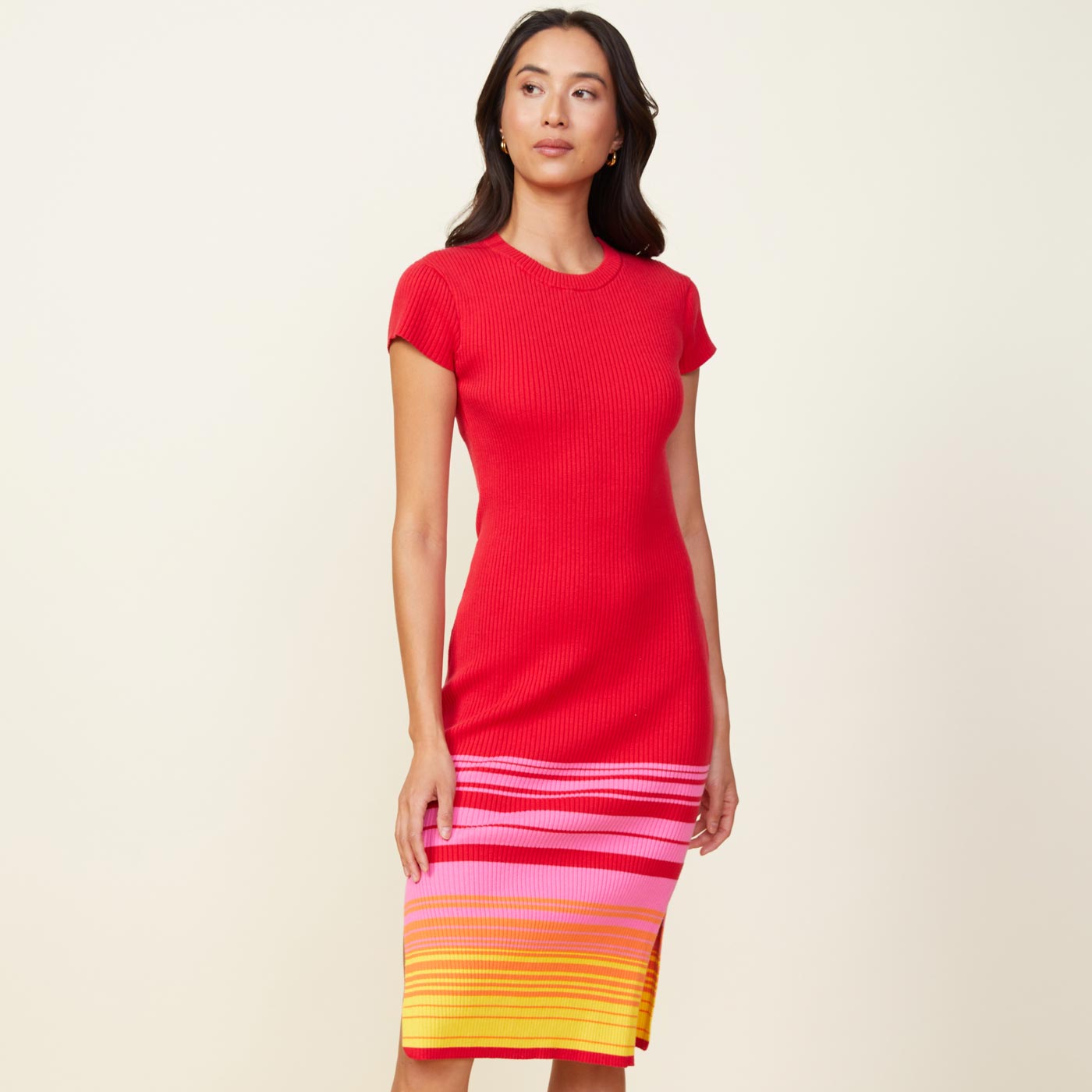 Front view of model wearing the sunset sweater cap sleeve midi dress in sunset.