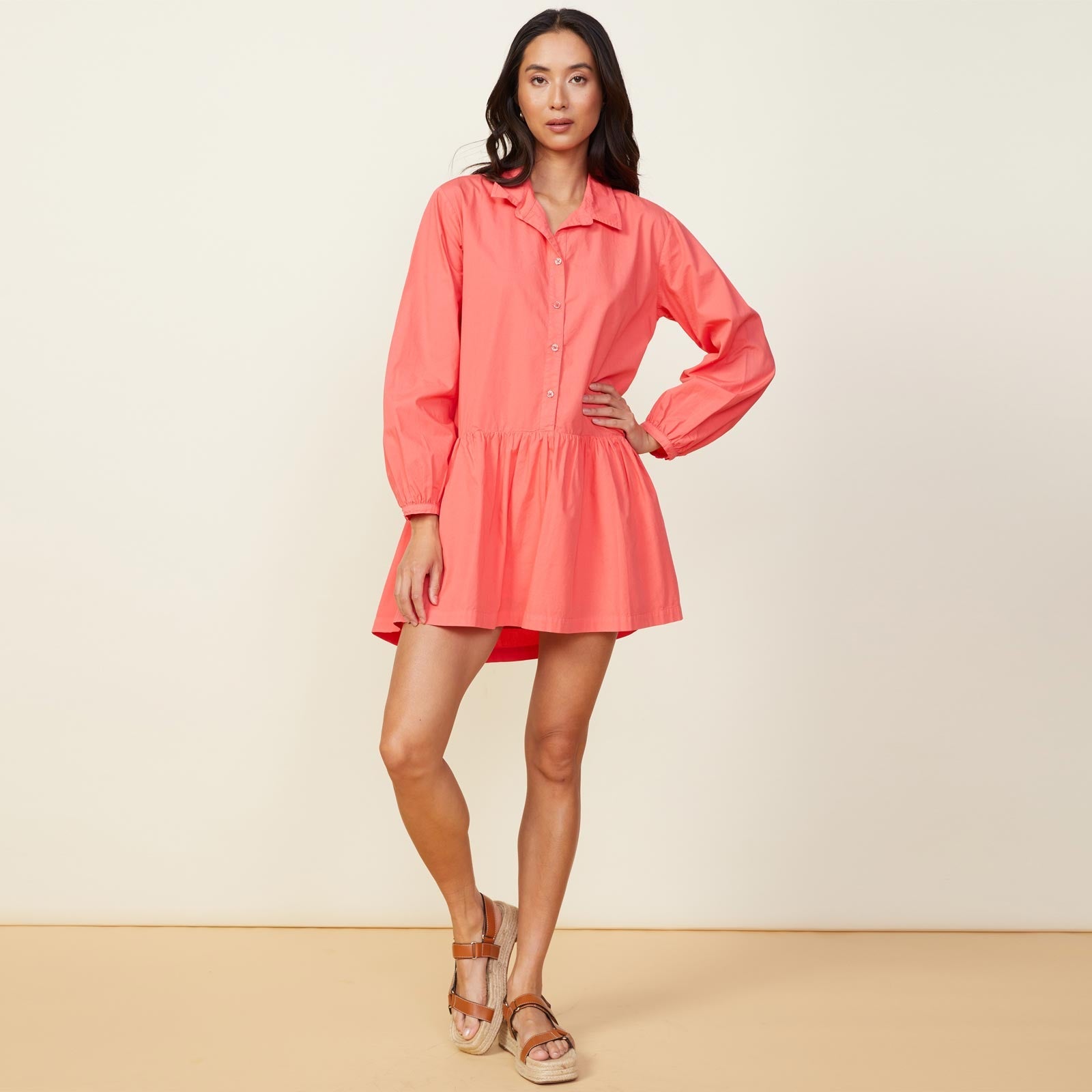 Front view of model wearing the poplin easy shirt dress in watermelon.