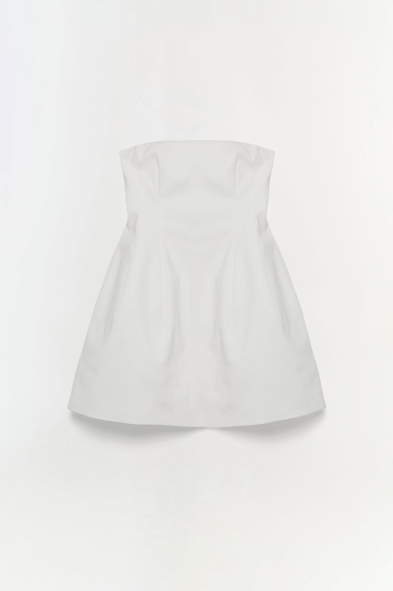 White strapless mini dress with fitted bodice and flared skirt.
