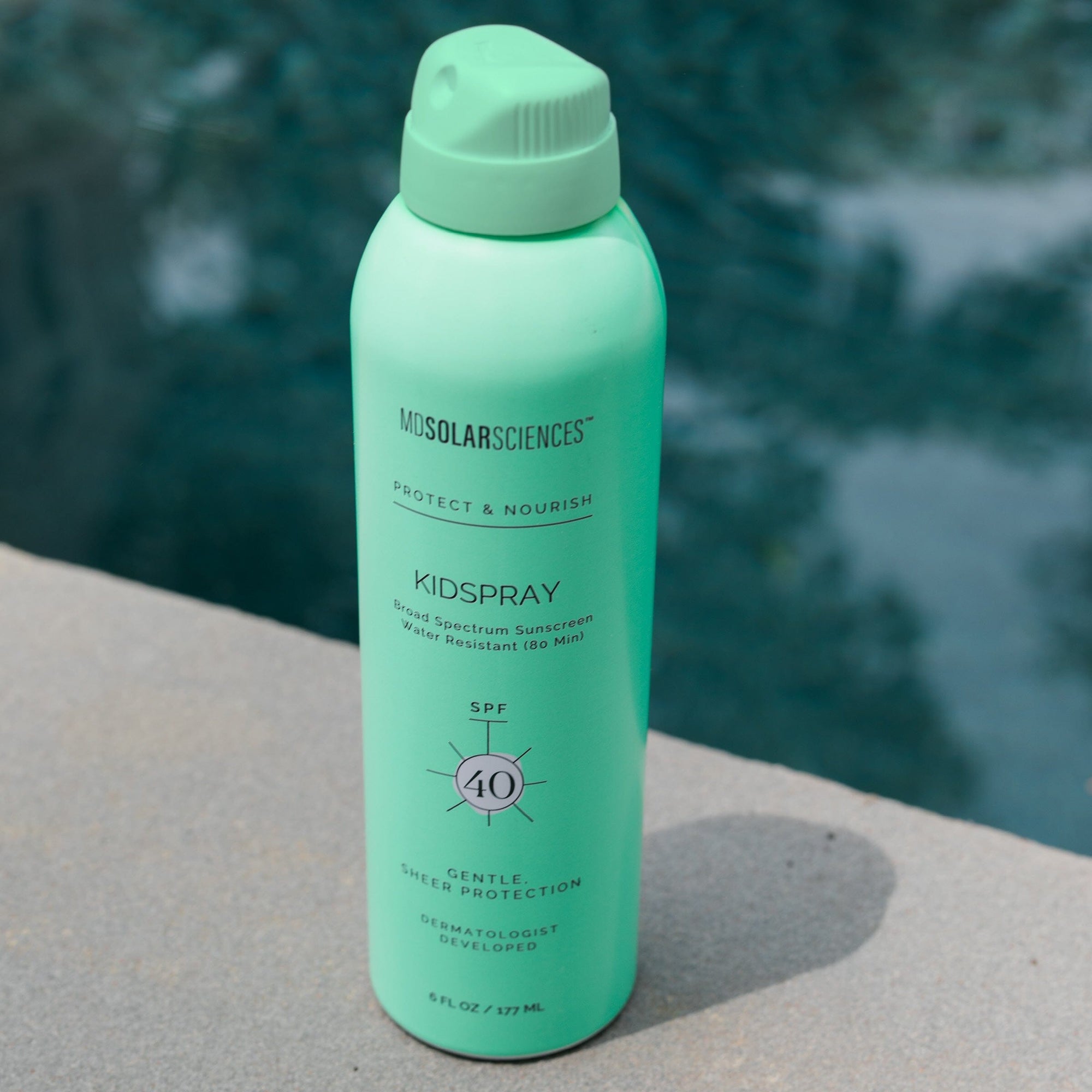 Green bottle of Mosolar Sciences Kidspray