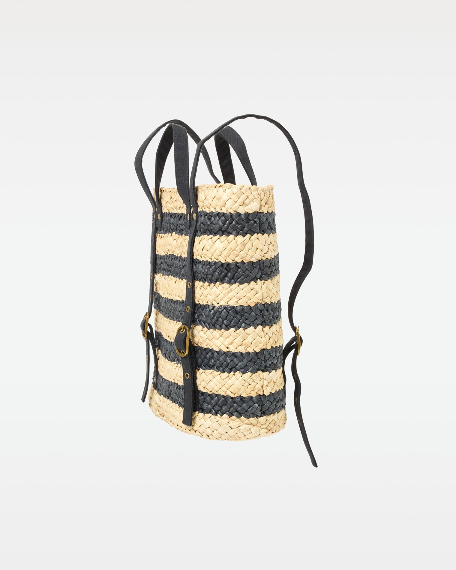 Side view of the Summer Days Backpack in natural-black showing the strap and buckle detail.