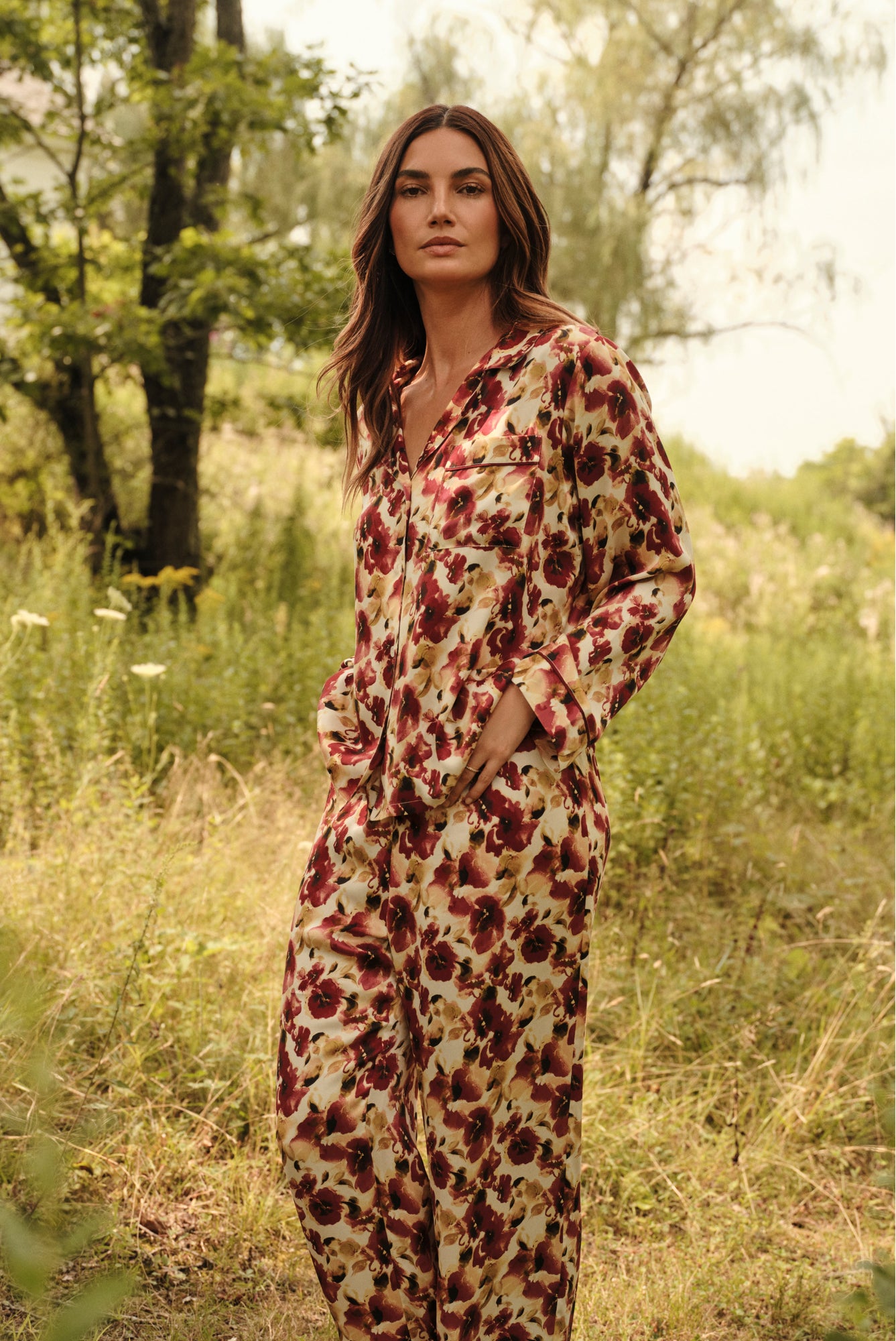 Model is wearing Inez Washable Silk Long PJ Set in Botanical Flower Merlot 