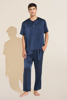 Model wears Charles Washable Silk Short Sleeve & Pant PJ Set in Navy.