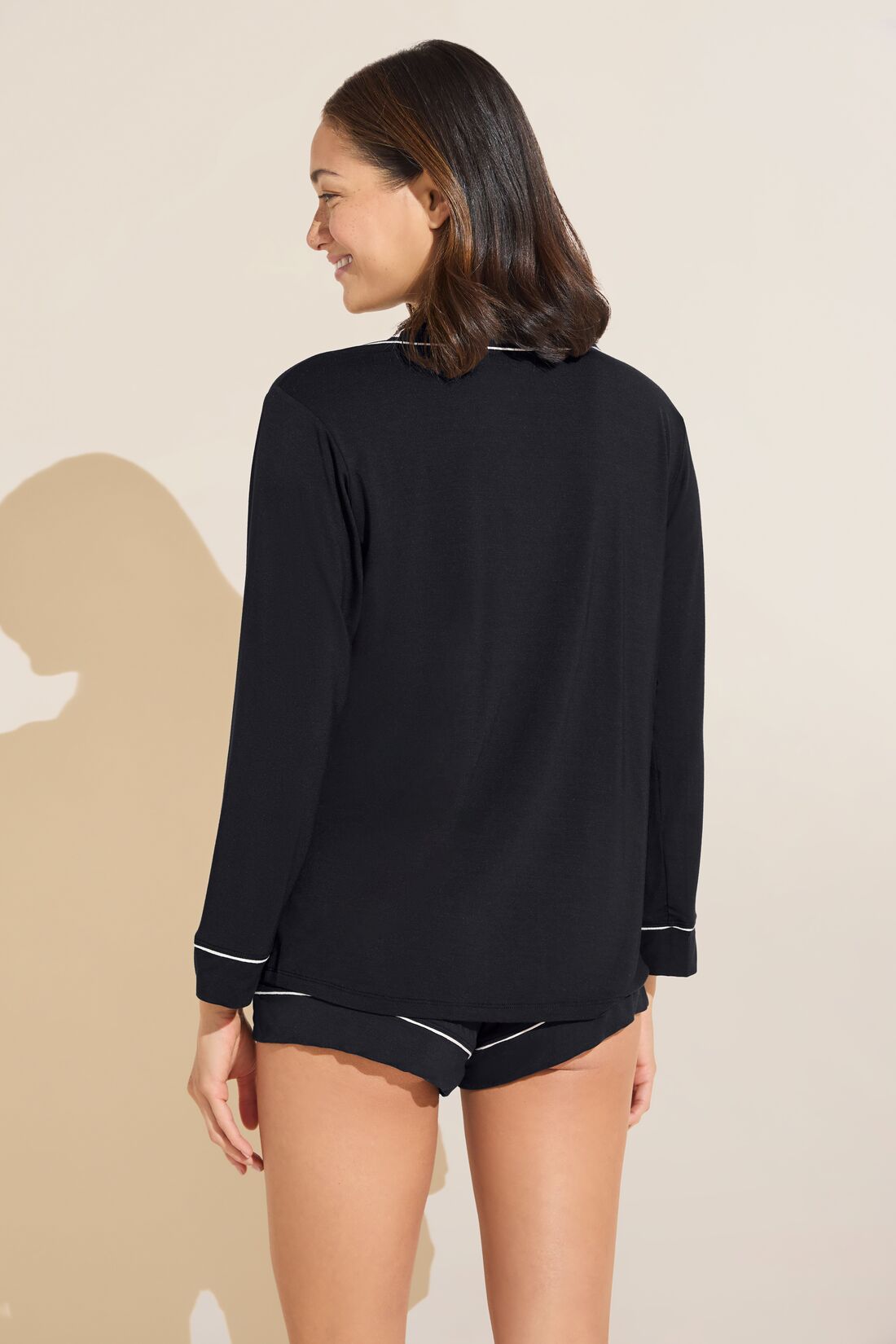 Model wears Gisele TENCELâ„¢ Modal Long Sleeve & Shortie Short PJ Set in black/sorbet pink.