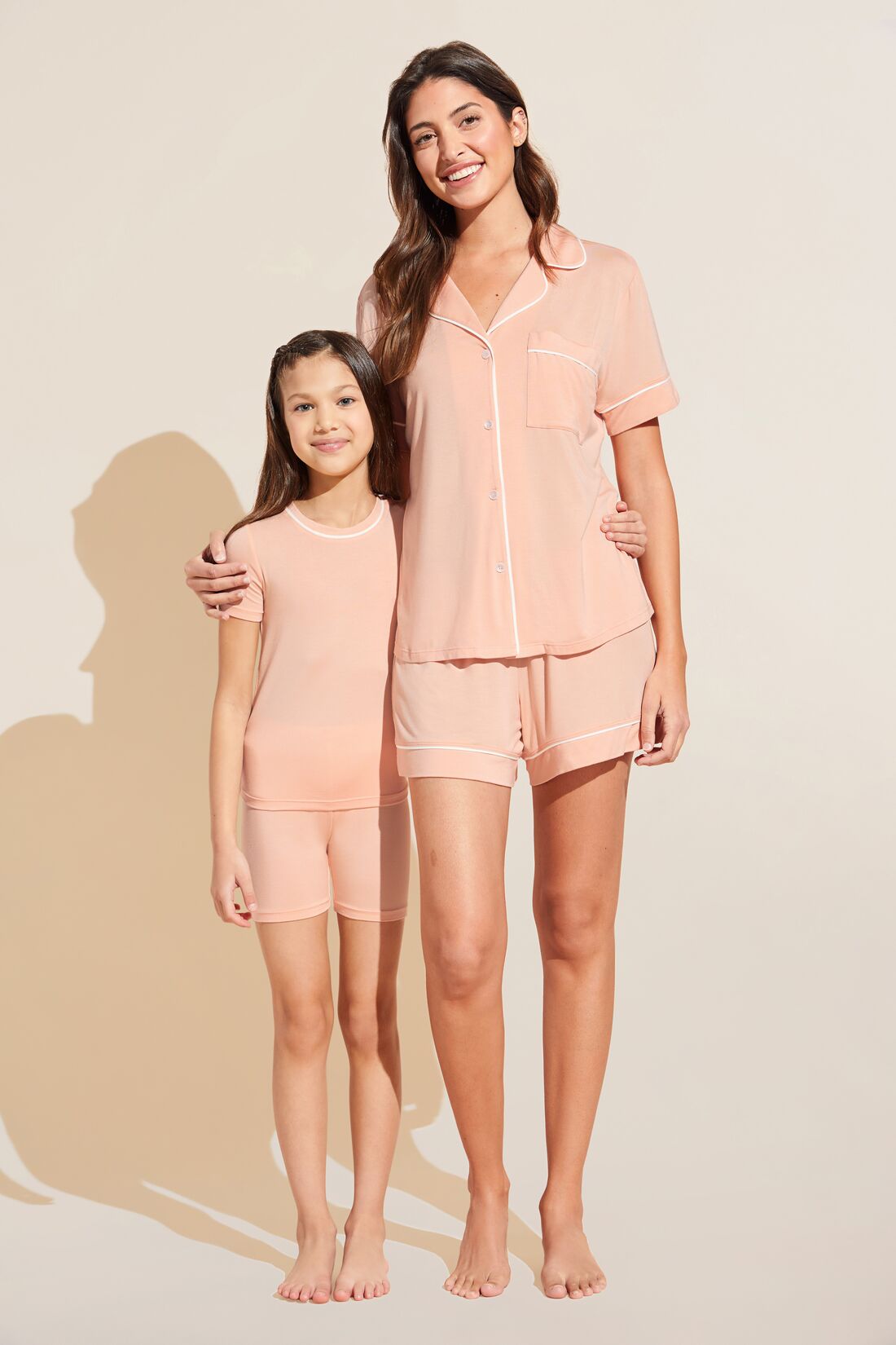 Model wears Kids TENCEL™ Modal Unisex Short PJ Set in peach parfait.