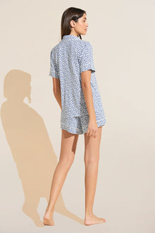 Model wears Gisele Printed TENCEL™ Modal Relaxed Short PJ Set in double diamond denim blue/ivory print.