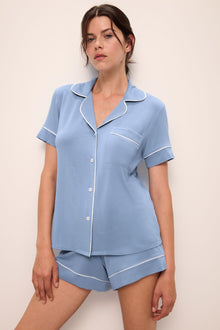 Model wears Gisele TENCELâ„¢ Modal Relaxed Short PJ Set in wedgewood blue/ivory.