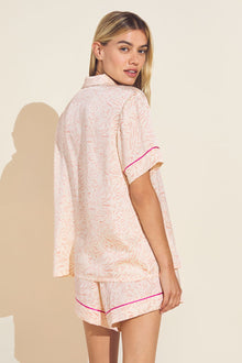 Model wears Inez Washable Silk Printed Short PJ Set in marble rose cloud print.