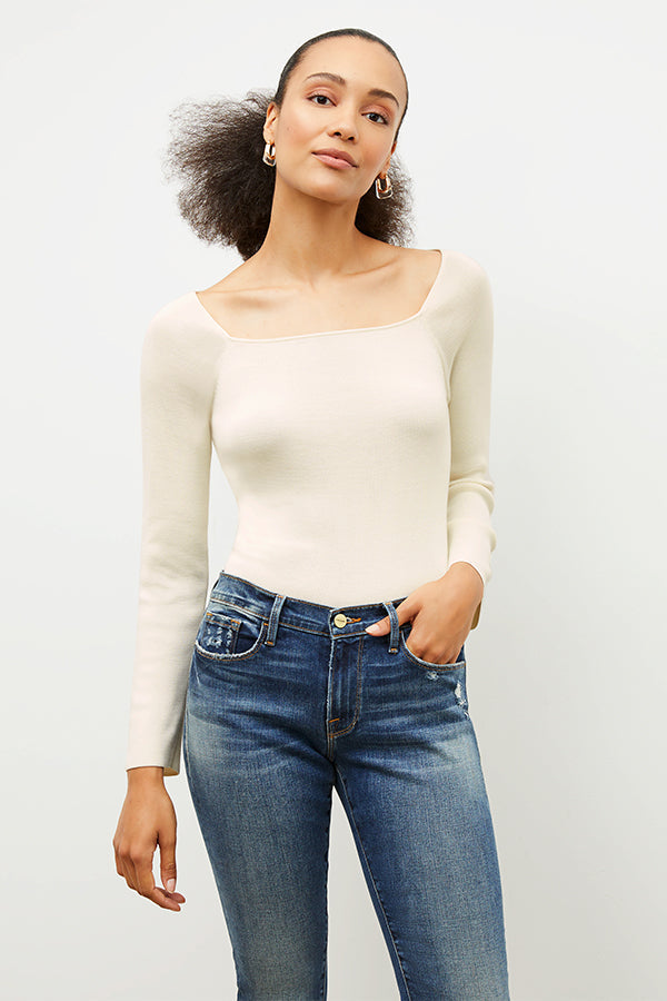 Front image of a woman wearing the Joya Top in Cream | Exclude | Grid