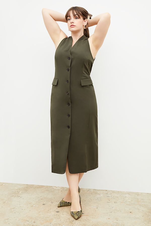 Back image of a woman wearing the Cassandra dress in origamitech in olive | Exclude
