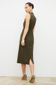 Back image of a woman wearing the Cassandra dress in origamitech in olive | Exclude | Grid Hover