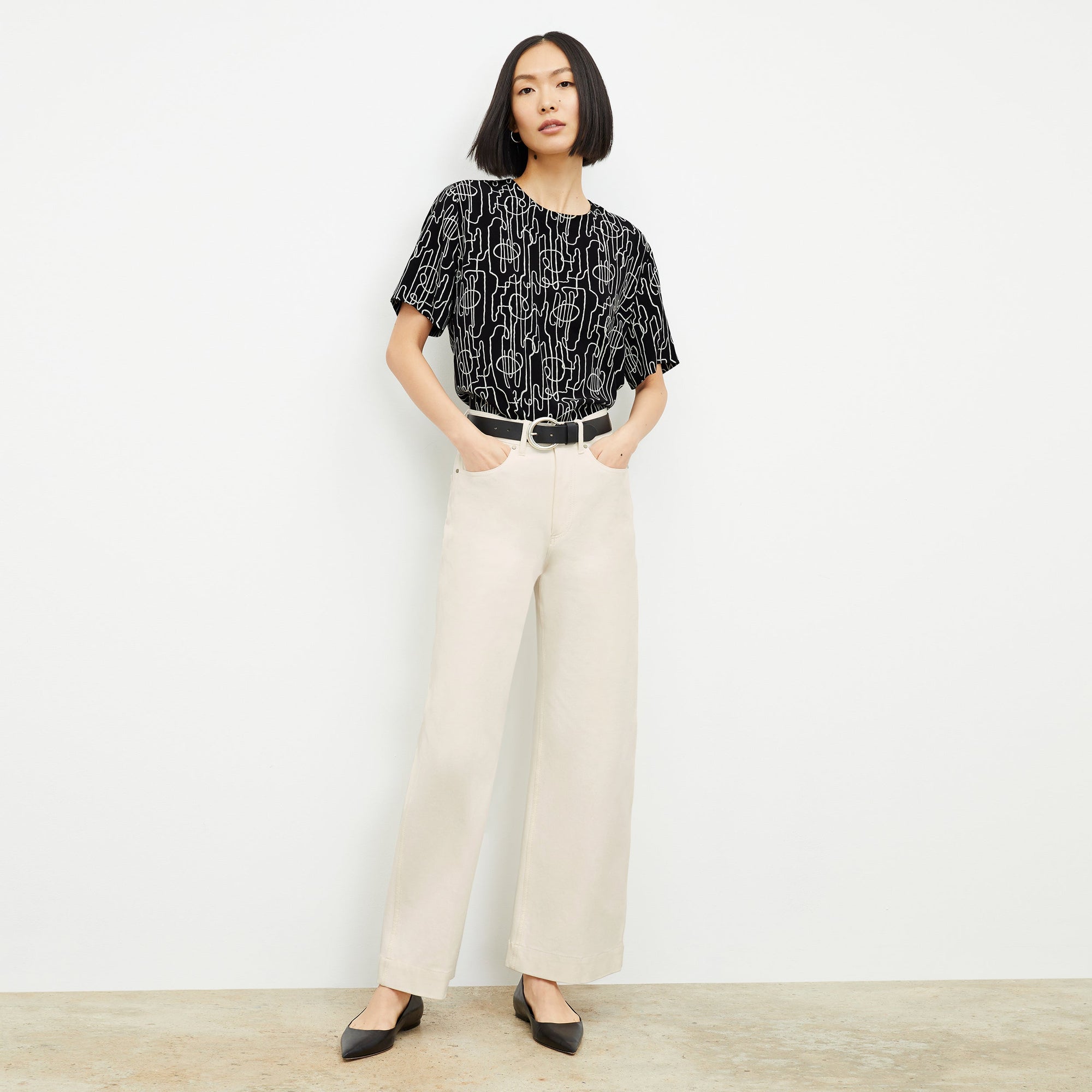 Front image of a woman wearing the Milo Jean in Tusk | Exclude