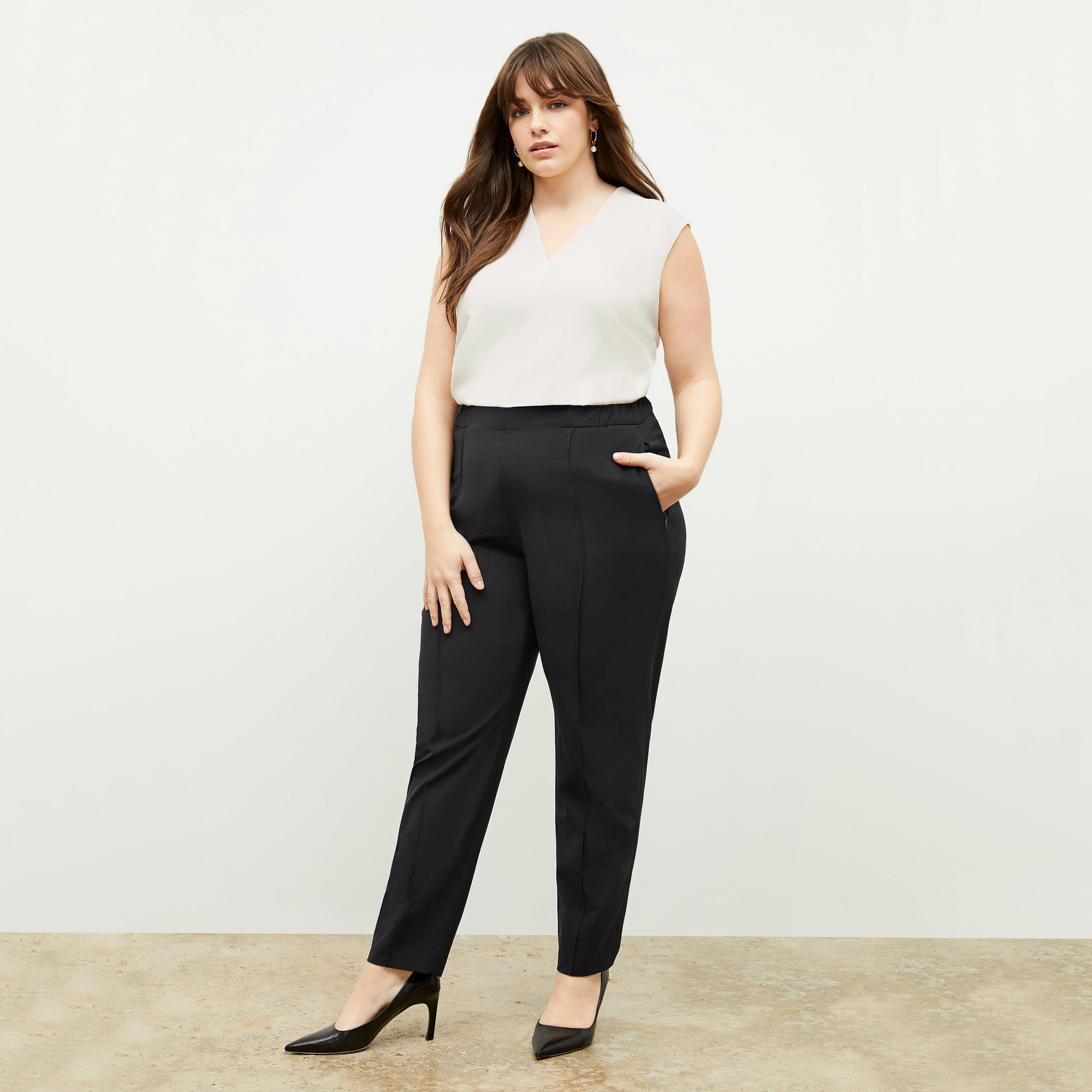 Front image of a woman standing wearing the Colby Jogger in Black