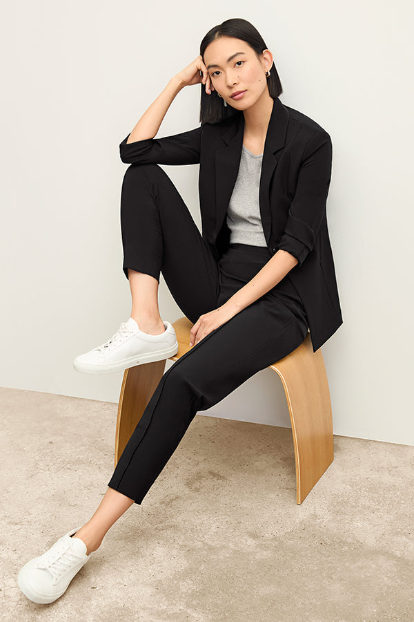 Front image of a woman standing wearing the Colby Jogger in Black | Exclude