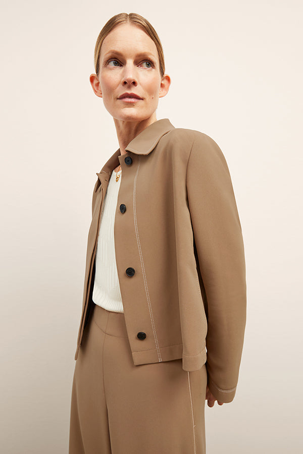 front image of a woman wearing the nicky jacket in saddle | Exclude | Grid