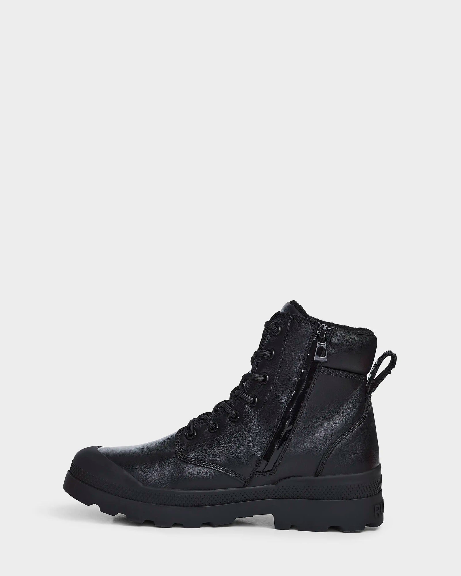 The Rudsak ARTUR - M223501 Black men's ankle boot, made of weather-treated black leather with a rugged sole, lace-up front, side zipper, and back pull tab, is shown in profile against a plain white background.