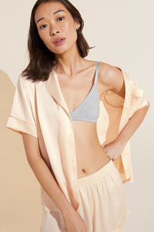 Model wears Inez Washable Silk Short PJ Set in champagne/ rose cloud.