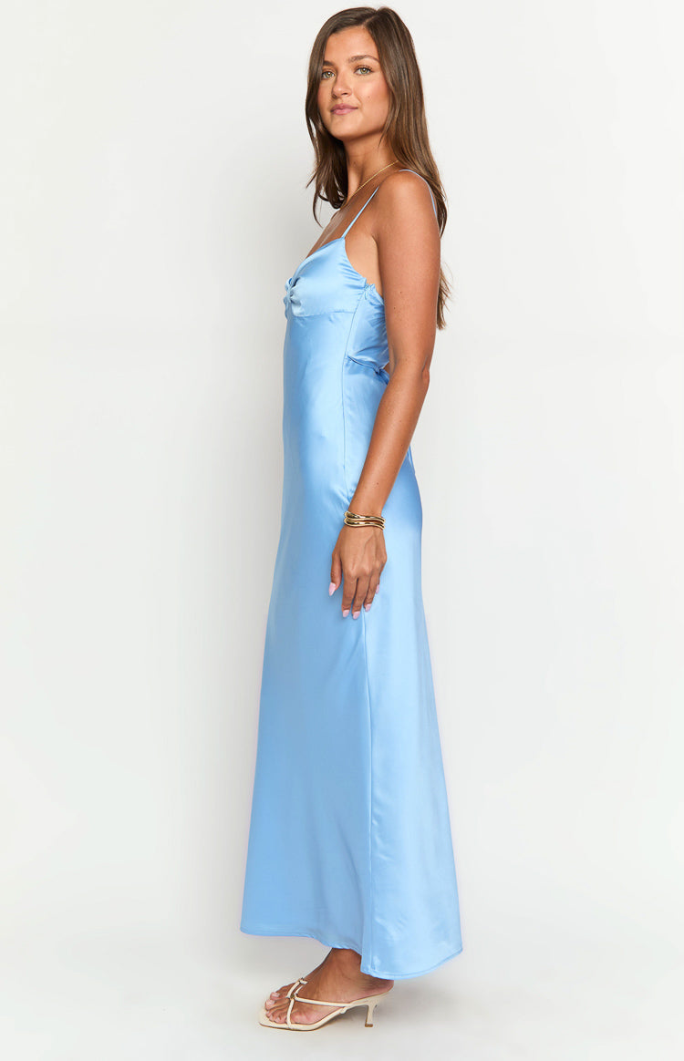 Side view of a blue satin maxi dress with spaghetti straps, a gathered bust detail, and a side cutout