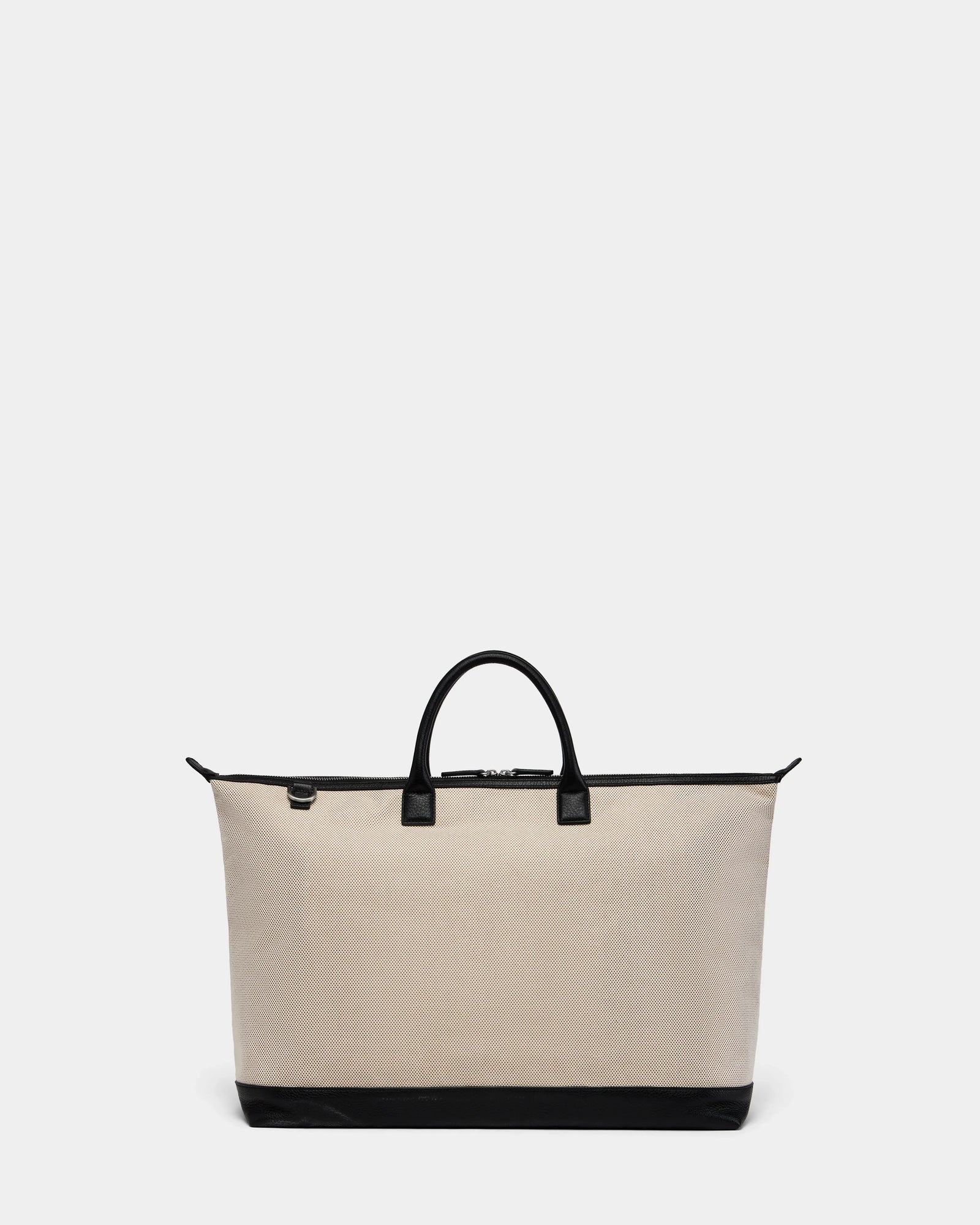 The Rudsak DUBLIN - 9324514 Vanilla is a beige canvas leather unisex tote with black handles, zipper, and base trim, ideal as a weekender bag. Displayed on a plain light gray background.