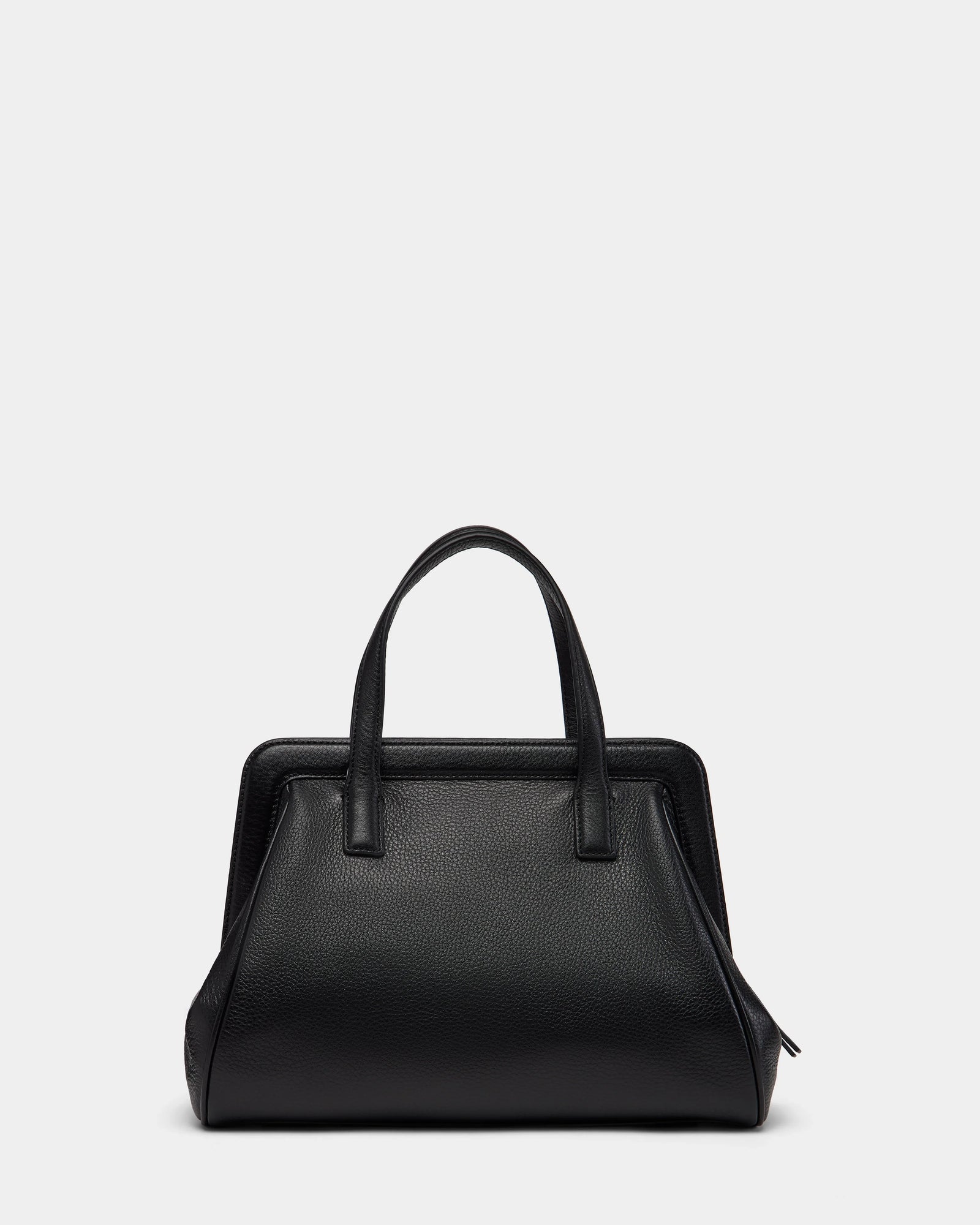 The Rudsak TAULLA - 8325002 Black women’s pebble leather satchel features two top handles, a structured rectangular silhouette with softly rounded sides, and a spacious interior, shown against a light gray background.