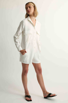 Woman wearing a white linen jumpsuit