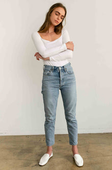 Woman wearing a white long sleeve