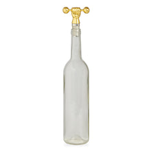 barbell bottle stopper brass with bottle - front view