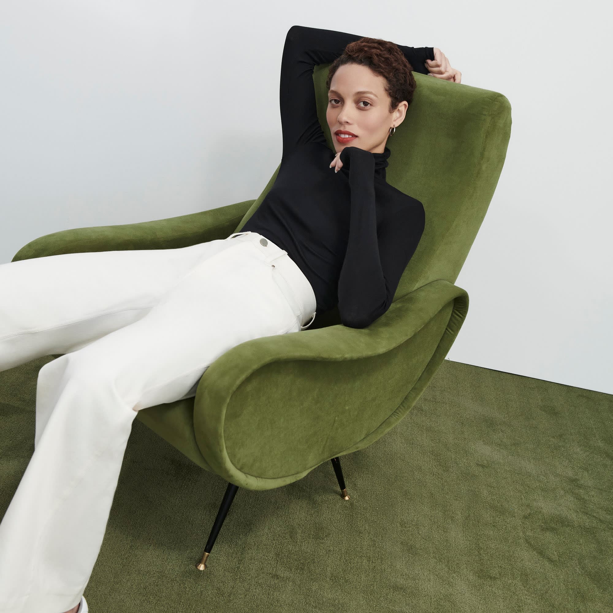 Side image of a woman standing wearing the milo jean in tusk | Exclude