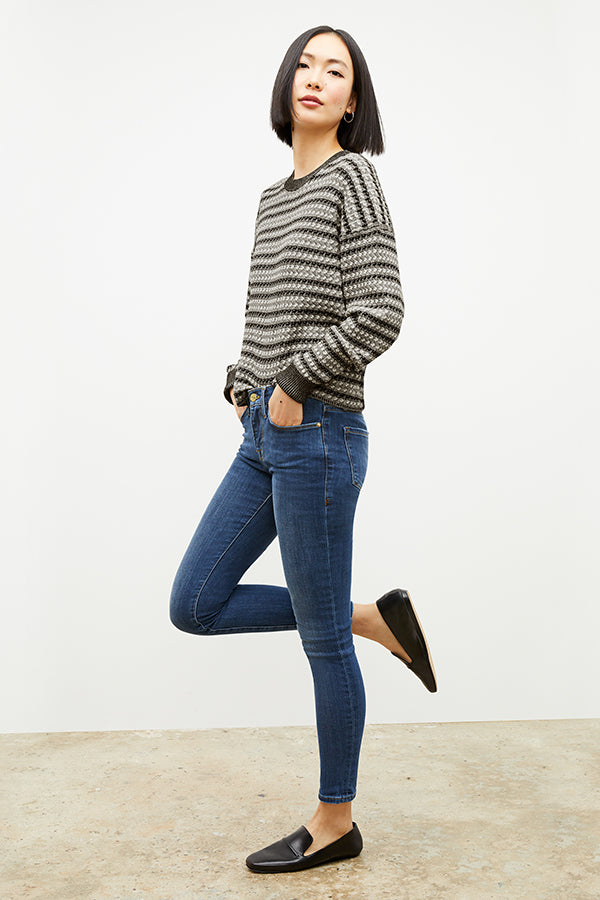 Side image of a woman wearing the tyler sweatshirt in black and white | Exclude | Grid