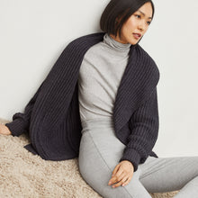 Side image of a woman standing wearing the Stella Legging in Gray Melange